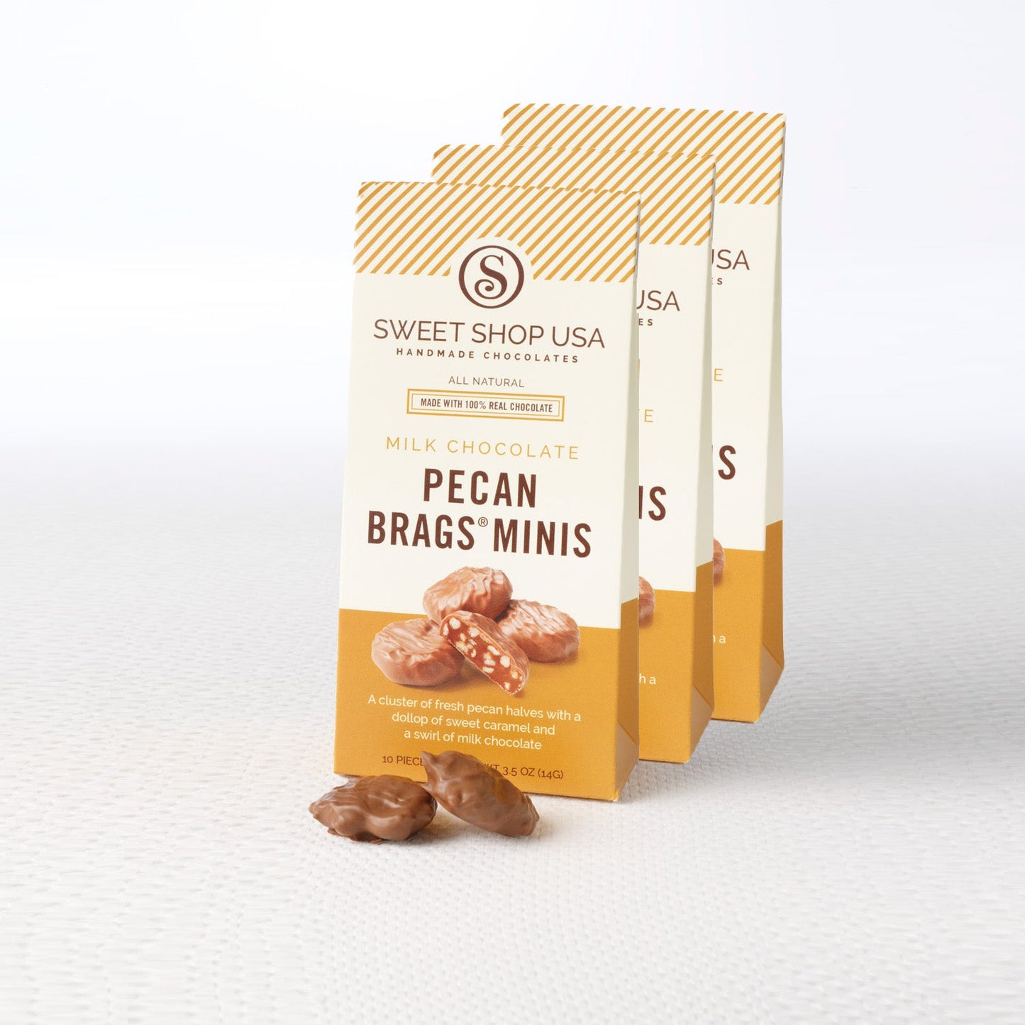 Three packages of Sweet Shop USA Pecan Brags Minis on a white background